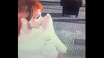 Redhead sucking male foot