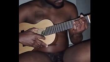 Translating Other Meanings Of Horns In The Air While Singing And Playing Guitar Naked thumbnail