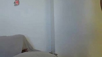 Cute brunette playing on webcam