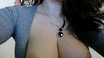 Cute brunette playing on webcam