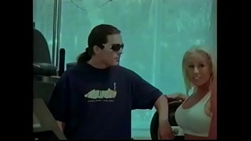 Blonde fucked by two males in the gym