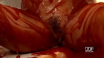 Chained babe peeing & bathing in red juice