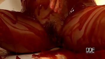 Chained babe peeing & bathing in red juice