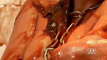 Chained babe peeing & bathing in red juice