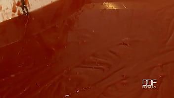 Chained babe peeing & bathing in red juice