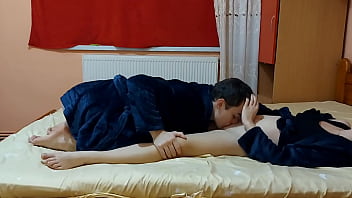 Hot young couple passionately make love in the bedroom