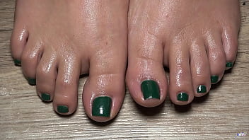 A close up view of my toes finger green nails useful to live your fetish