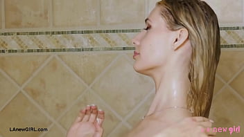 Radiant blonde beauty enjoys a sensual bath