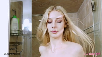 Radiant blonde beauty enjoys a sensual bath