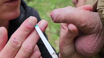Smoking two cigarettes and give him blow job with cumshoot on my face when i smoked