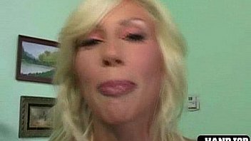 Big breasted girl jerks cock off