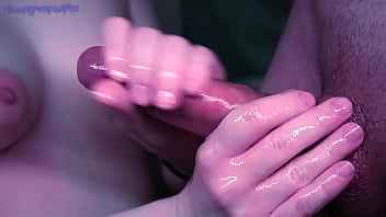 A bitch in a mask loves to jerk off dick with oil