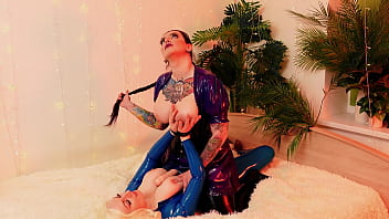 Two titty chicks have fun with a big dildo gothic tattooed brunette dominates cute and horny blonde