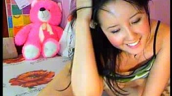 Cute brunette fingers her holes with both hands 2