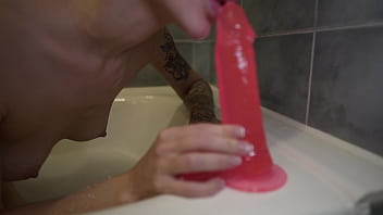 Sexy bitch passionately masturbates huge rubber cock wet vagina in the bathroom on camera