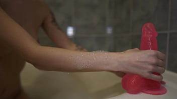 Sexy bitch passionately masturbates huge rubber cock wet vagina in the bathroom on camera