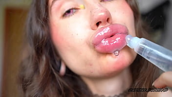 Wet messy lipgloss layers and pouting kisses