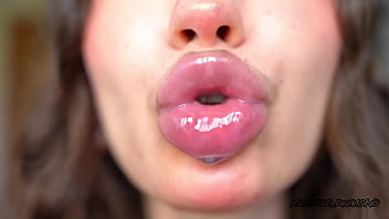 Wet messy lipgloss layers and pouting kisses