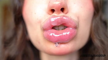 Wet messy lipgloss layers and pouting kisses