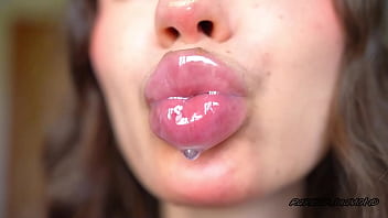 Wet messy lipgloss layers and pouting kisses