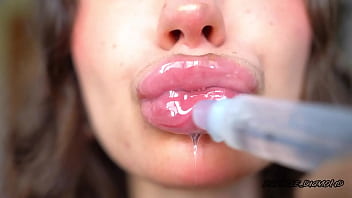 Wet messy lipgloss layers and pouting kisses