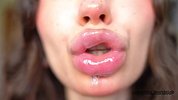Wet messy lipgloss layers and pouting kisses