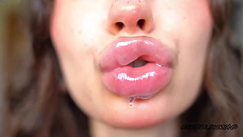 Wet messy lipgloss layers and pouting kisses