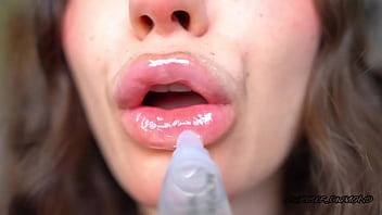 Wet messy lipgloss layers and pouting kisses