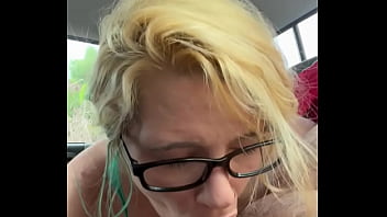 Pretty streetwalker in nude while giving a blowjob in the backseat of a car and takes a load in her mouth