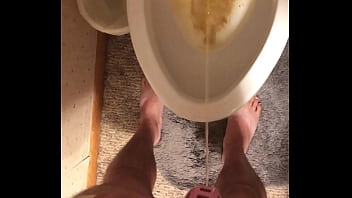 Caged Up While Taking A Pee thumbnail