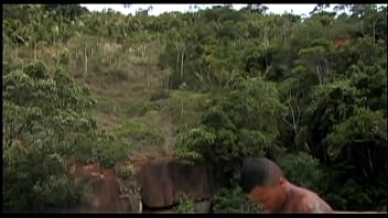 Bisexual exotic beauties enjoy threesome fucking with a handsome guy who finally gives them a big shower with his jizz