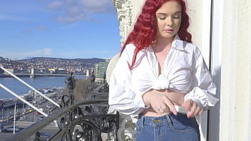 Wetting jeans and smoking on balcony
