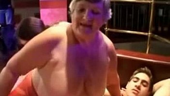Fat grannies having nasty sex in a strip club with horny young studs