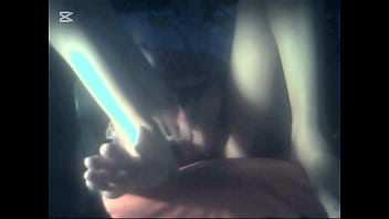 The camera under the table captured a beautiful woman at home alone and watching a porn movie