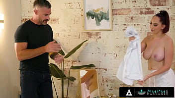 Busty redhead fucks with client during nuru