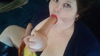 Betty reddd sucks a dildo and plays with her tits