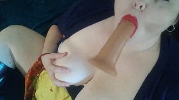 Betty reddd sucks a dildo and plays with her tits