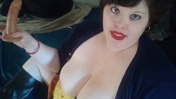 Betty reddd sucks a dildo and plays with her tits