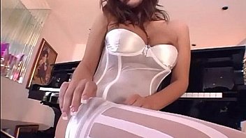 Sexy brunette in white stockings and panties