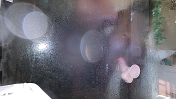 Hot ebony milf tries her new toy in shower and gets caught