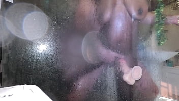 Hot ebony milf tries her new toy in shower and gets caught