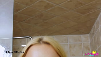 Charming blonde model enjoys a sensual bath