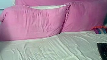 Sexy whore wearing black stockings masturbates