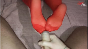 Milf in handcuffs and red stockings gets cum on the soles