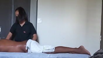 Spa girl massaging boy