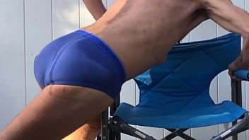 Deep pelvic stretching in blue briefs on blue chair late october 2024