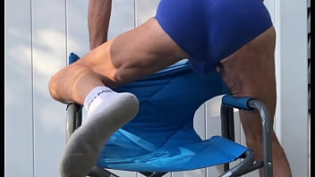 Deep pelvic stretching in blue briefs on blue chair late october 2024