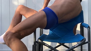 Deep pelvic stretching in blue briefs on blue chair late october 2024