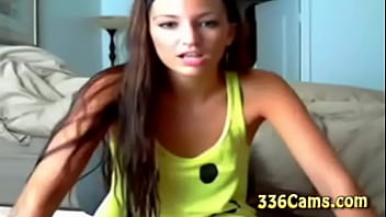 Sexy brunette teen with smile on yellow t shirt play on webcam