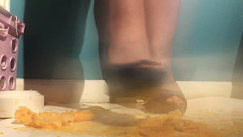 Sexy girl with lovely feet tramples sploshes her cookies